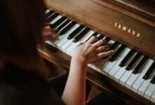 woman playing Yamaha piano