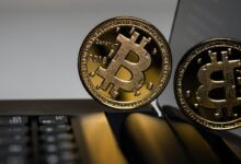 two gold Bitcoins