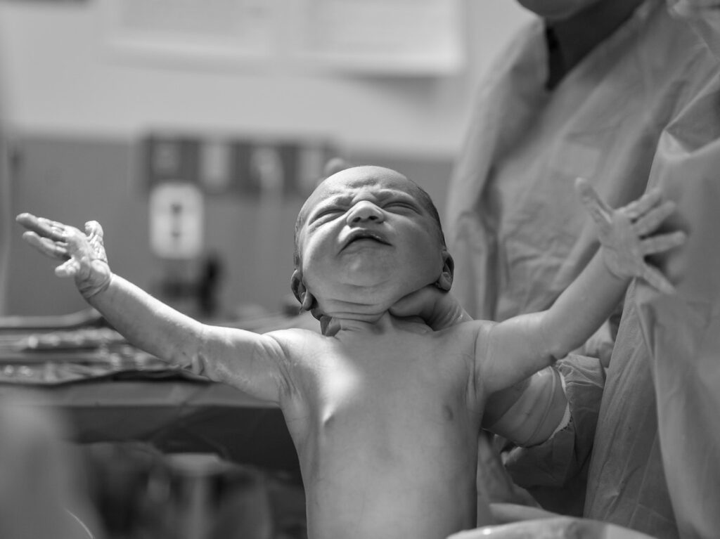 grayscale photography of a new born baby