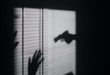 silhouette of person on window