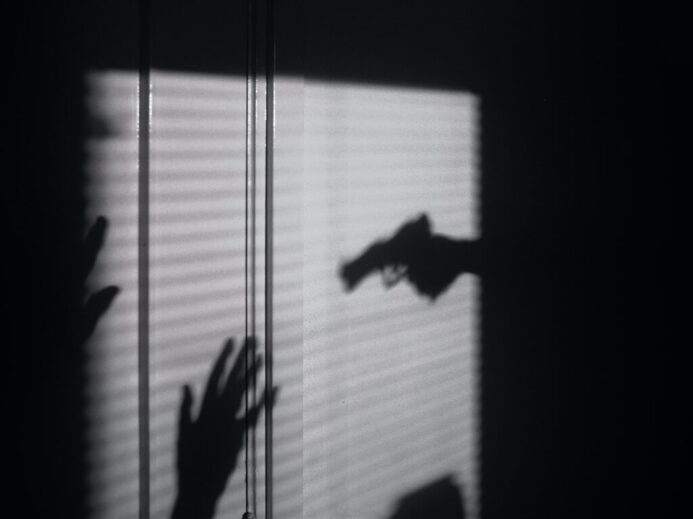 silhouette of person on window