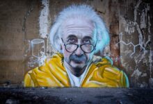 man in yellow and blue hoodie wearing eyeglasses