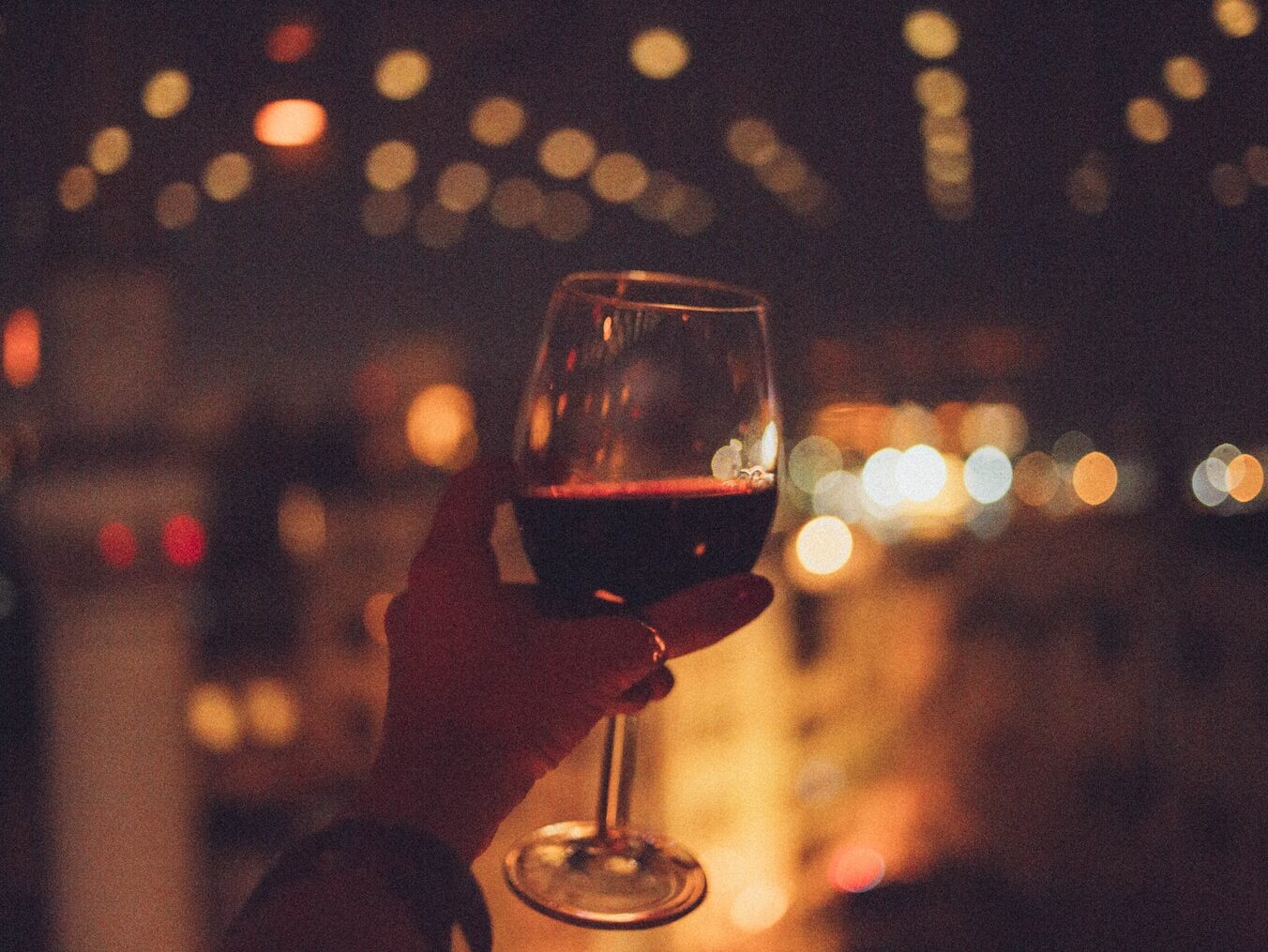 Person Holding Cup of Wine