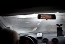 person driving car during daytime