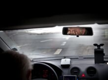 person driving car during daytime