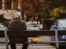 man sitting on bench