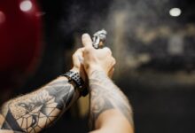 Hands of a Person Holding a Firearm