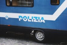blue and white bus on road during daytime