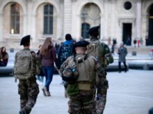 men in army uniform near building during daytime