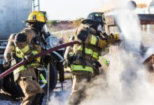 three fireman preventing fire during daytime