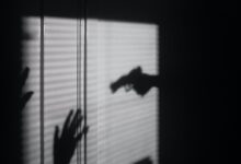 silhouette of person on window