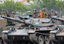 people riding battle tank during daytime
