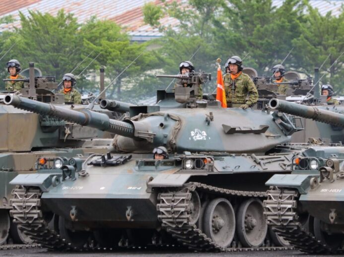 people riding battle tank during daytime