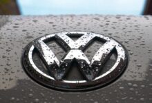 water dew on silver Volkswagen car emblem
