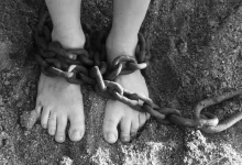 chains, feet, sand