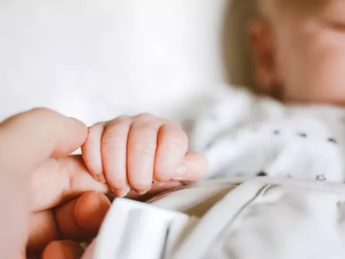 Person Holding Baby's Hand