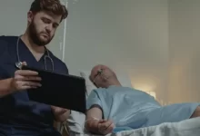 Doctor Sitting beside a Patient