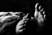 Grascale Photography of Toddlers Foot