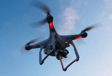 drone flying under white sky