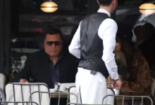 man wearing black suit jacket