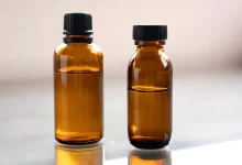 a couple of brown bottles sitting on top of a table