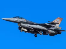 gray fighter jet flying in the sky