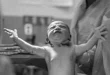 grayscale photography of a new born baby