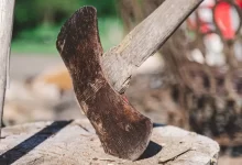 an old shoe is sitting on a piece of wood
