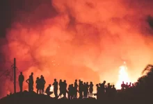 people near bonfire during night