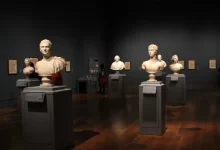 Assorted Busts on Gray Stand