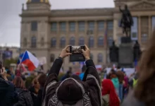 a person taking a picture of a crowd of people