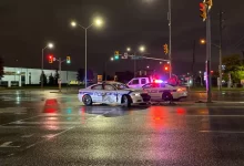 two police cars on road