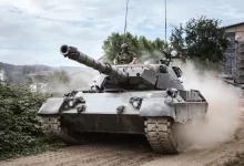 battle tank on green grass field during daytime