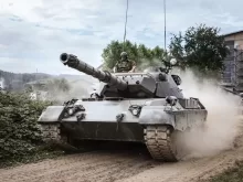 battle tank on green grass field during daytime