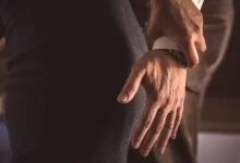 a man and woman holding hands