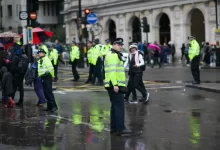 man wears green safety jacekt