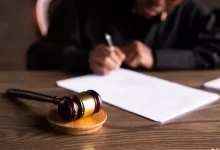 Judge Signing on the Papers