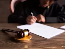 Judge Signing on the Papers