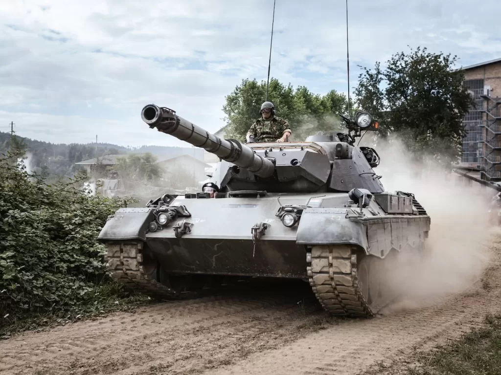 battle tank on green grass field during daytime