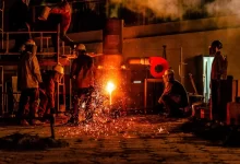 construction men front of fire