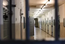 a long hallway with a bunch of lockers in it