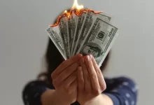 a fan of fake American dollars on fire