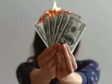 a fan of fake American dollars on fire
