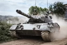 battle tank on green grass field during daytime