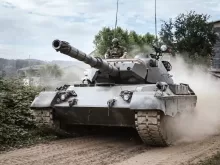 battle tank on green grass field during daytime