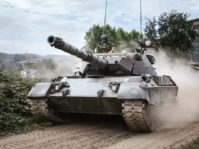 battle tank on green grass field during daytime