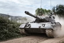 battle tank on green grass field during daytime