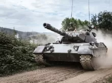 battle tank on green grass field during daytime
