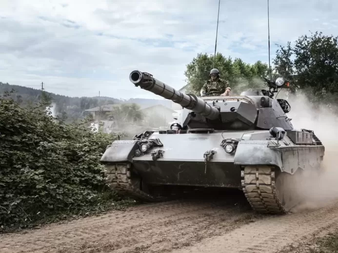 battle tank on green grass field during daytime