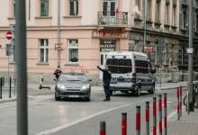 white and black police car on road during daytime
